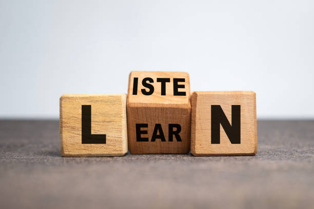 listen and learn words on turn wooden blocks isolated on white background